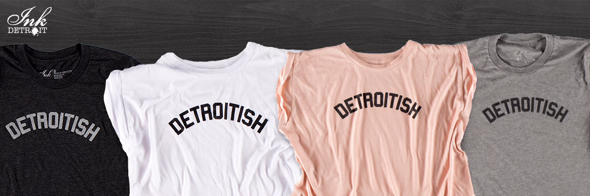 Ink Detroit logo on dark wood texture